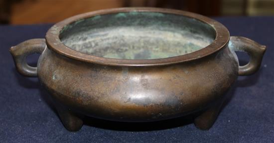 A Chinese brown patinated bronze ding censer, Xuande six character mark, probably 17th/18th century, width 21cm